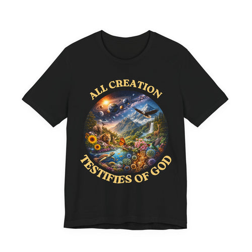 A black short-sleeve crewneck t-shirt featuring a large circular multicolor graphic on the chest with the text 'ALL CREATION TESTIFIES OF GOD' in gold lettering, shown against a plain white background.