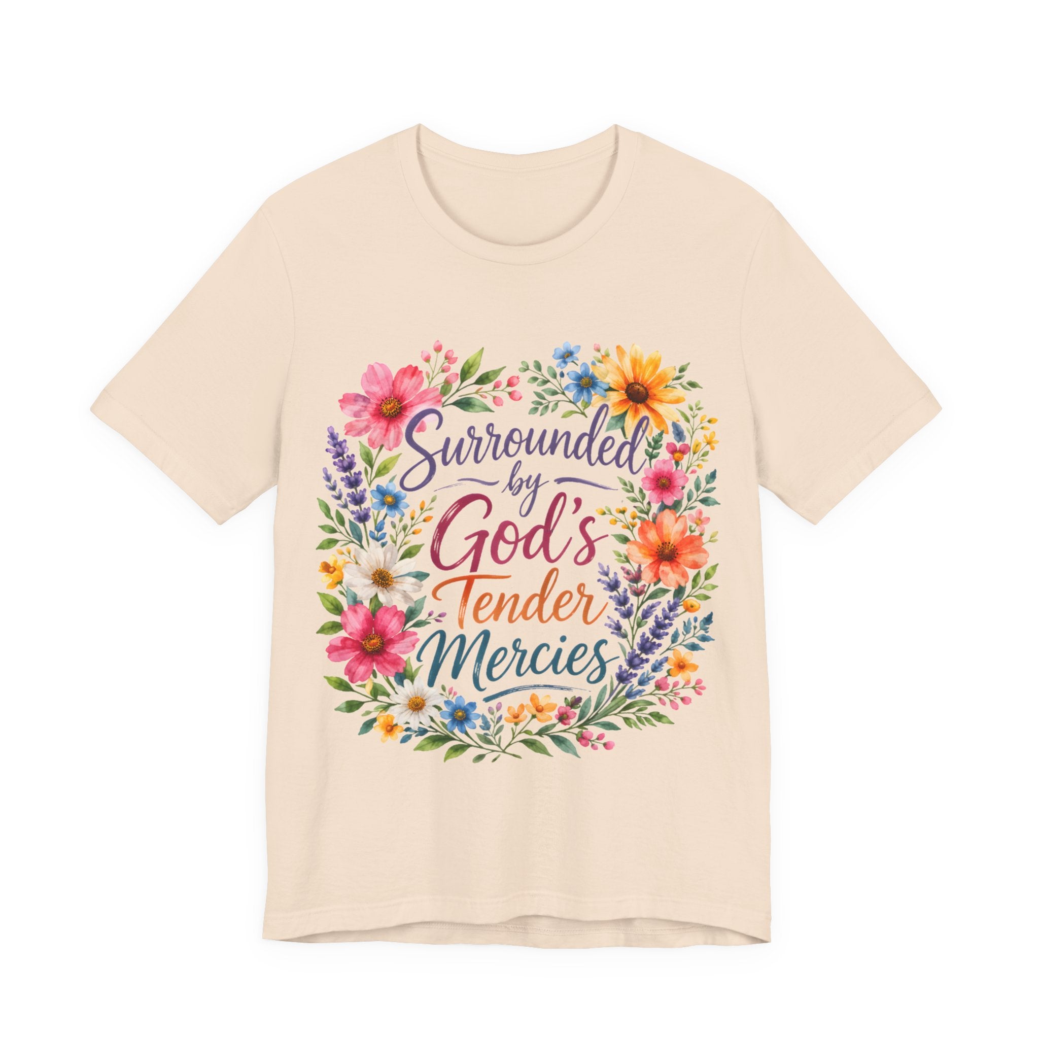 Soft Cream t-shirt with colorful floral design and text 'Surrounded by God's Tender Mercies' on a white background
