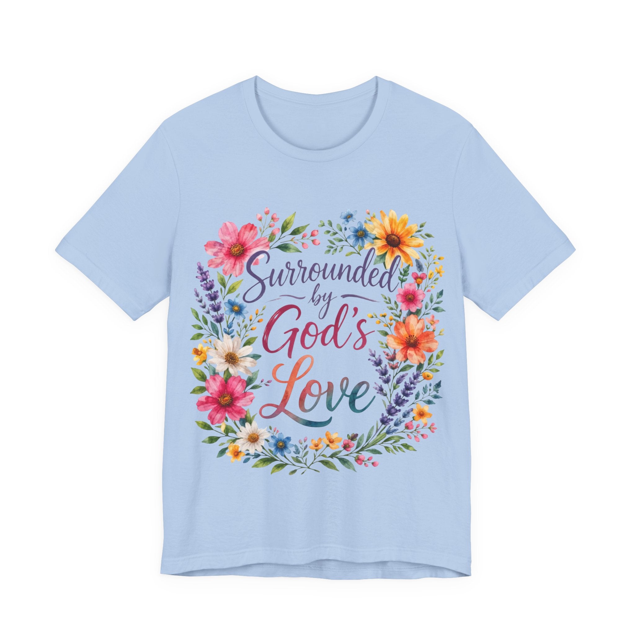 Baby Blue t-shirt with colorful floral design and text 'Surrounded by God's Love' on a white background