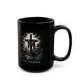 Black mug with a cross and 'It is Finished' text on a white background
