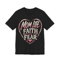 Black t-shirt with pink heart design and text 'Mom Life Faith Over Fear' on a white background