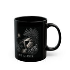 Black mug with white graphic design on a white background