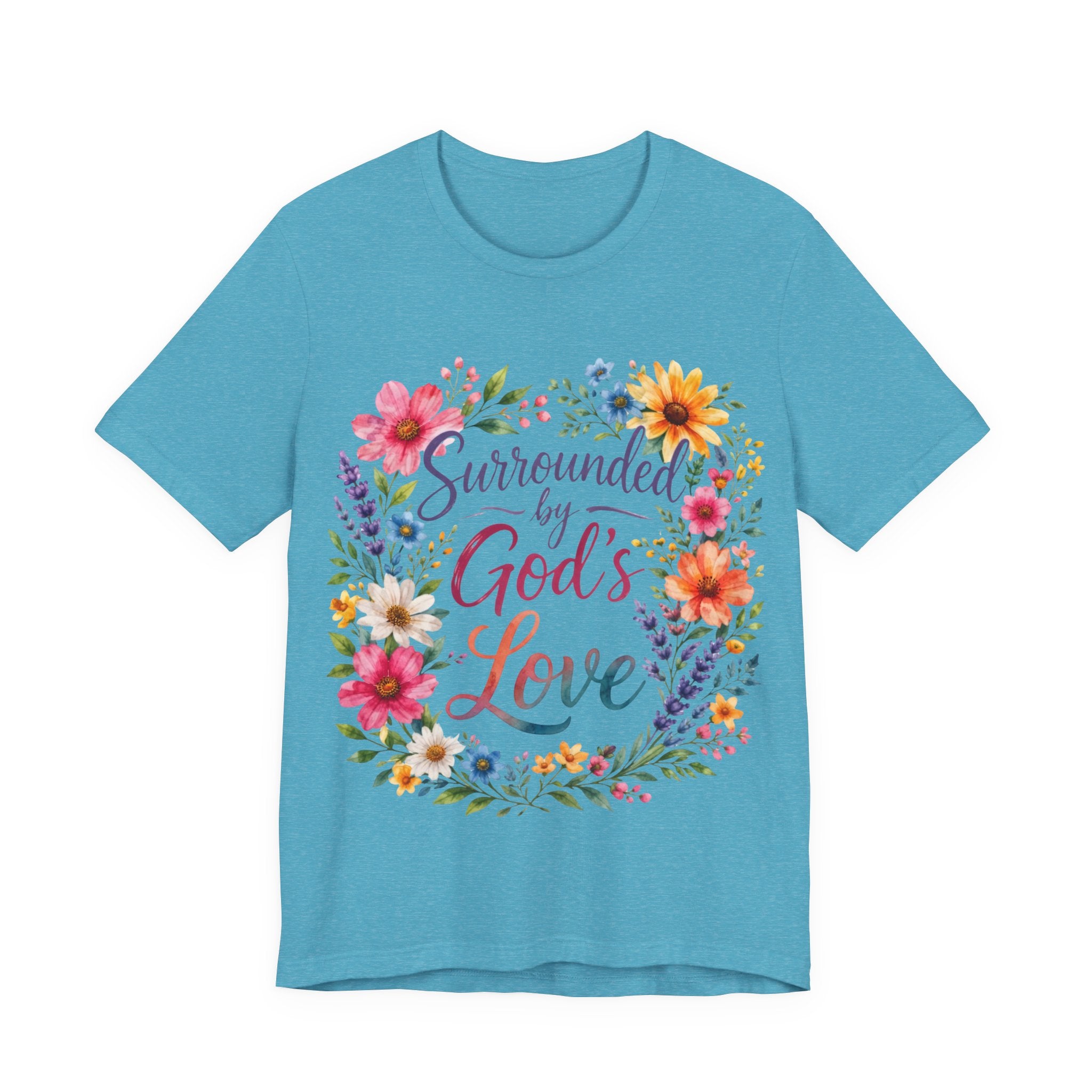 Heather Aqua t-shirt with colorful floral design and text 'Surrounded by God's Love' on a white background