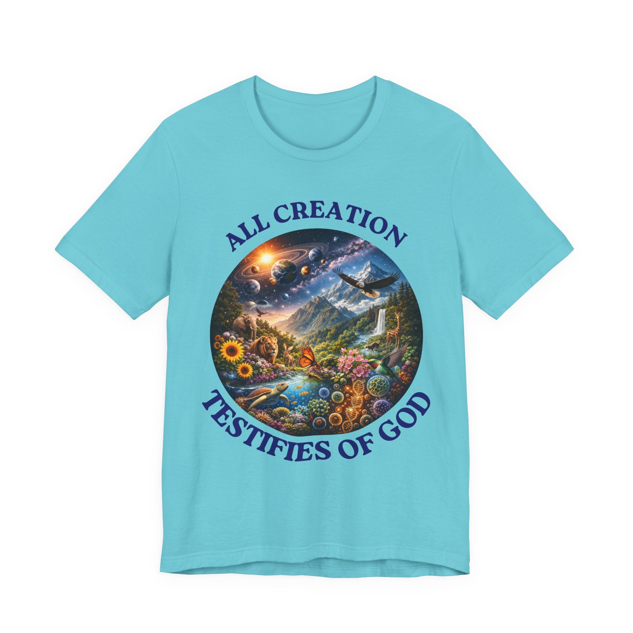 A light blue short-sleeve t-shirt with a circular multicolor graphic on the front depicting a scenic landscape, planets, and a waterfall, surrounded by the text 'ALL CREATION TESTIFIES OF GOD' in dark blue.