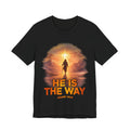 Black t-shirt with a religious design featuring a person walking towards a light, with 'He is the Way' text.