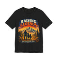 Black t-shirt with 'Raising Legends' graphic design featuring a silhouette of a father and two children against a mountain backdrop.